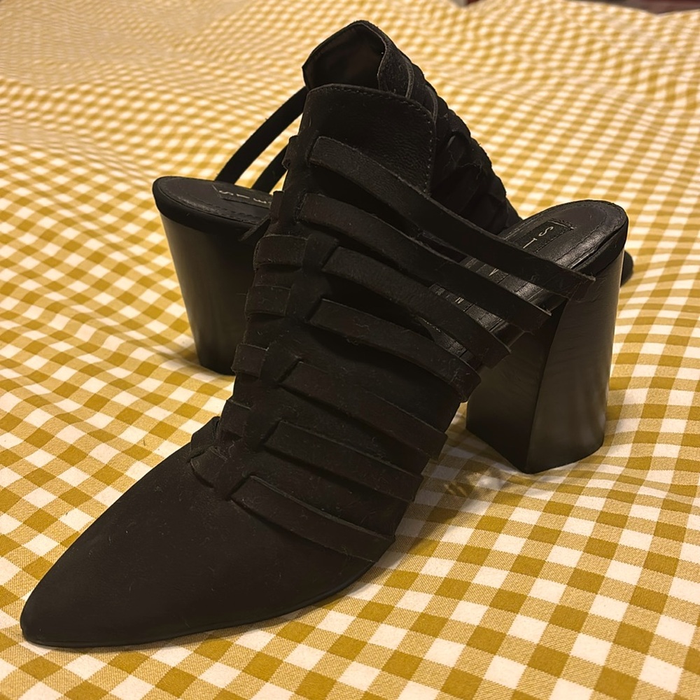 Black caged mules, with pointed toe.